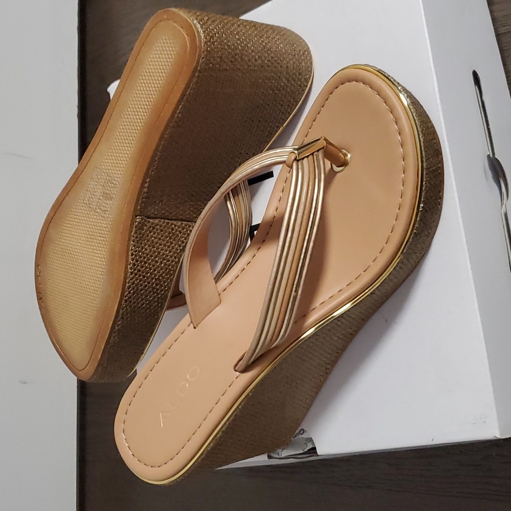 Tan sandals with gold accents and heel